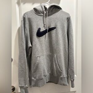 Grey Nike hoodie with embroidered swoosh